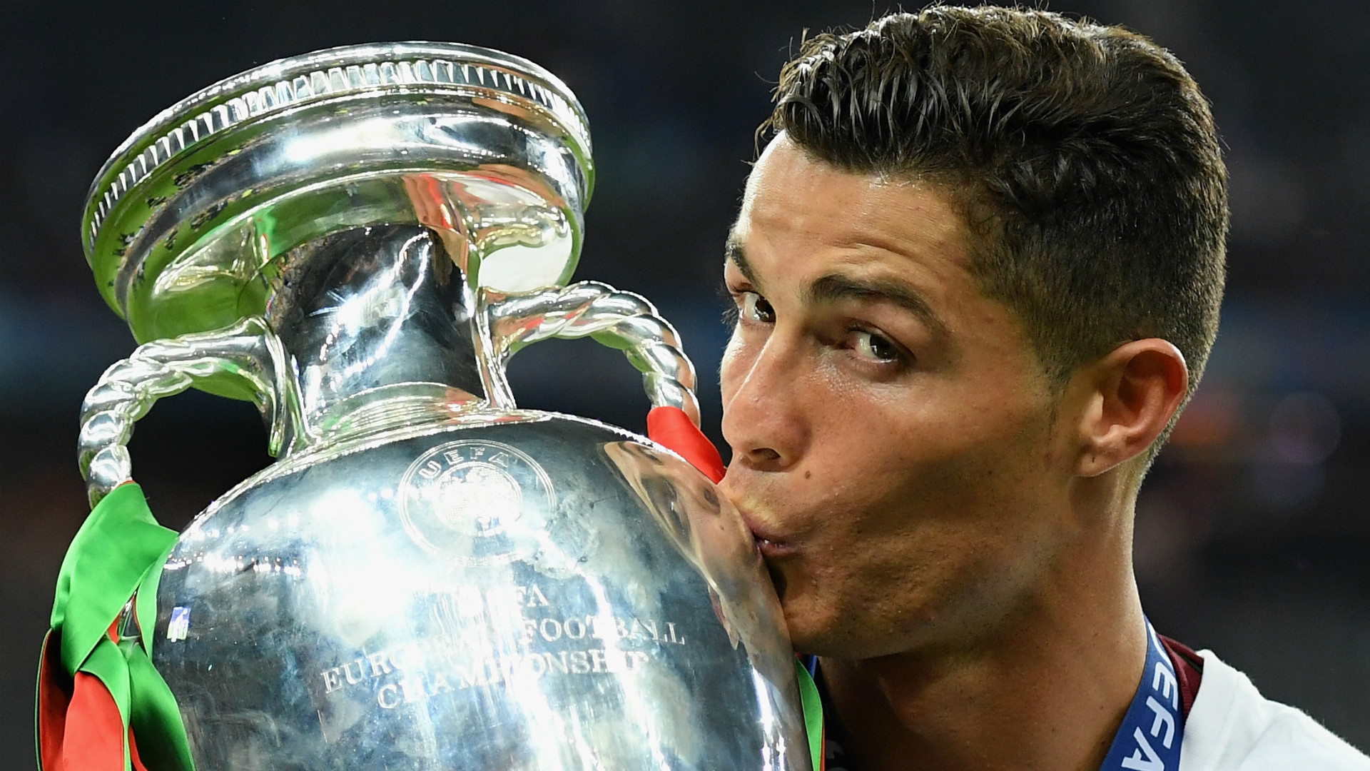 Cristiano Ronaldo kissing the Champions Trophy