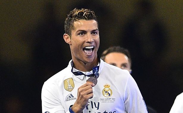 Cristiano Ronaldo smiling after winning a Medal